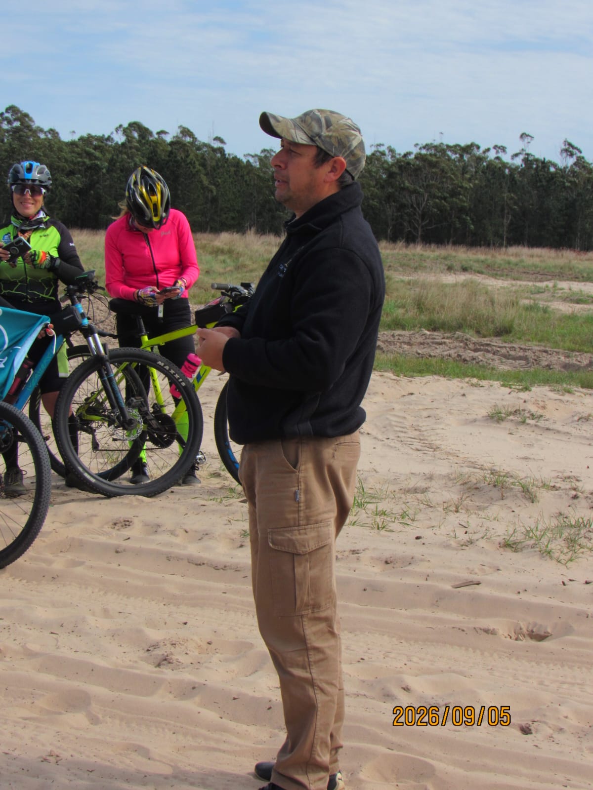 The guide, with the cyclists to one side