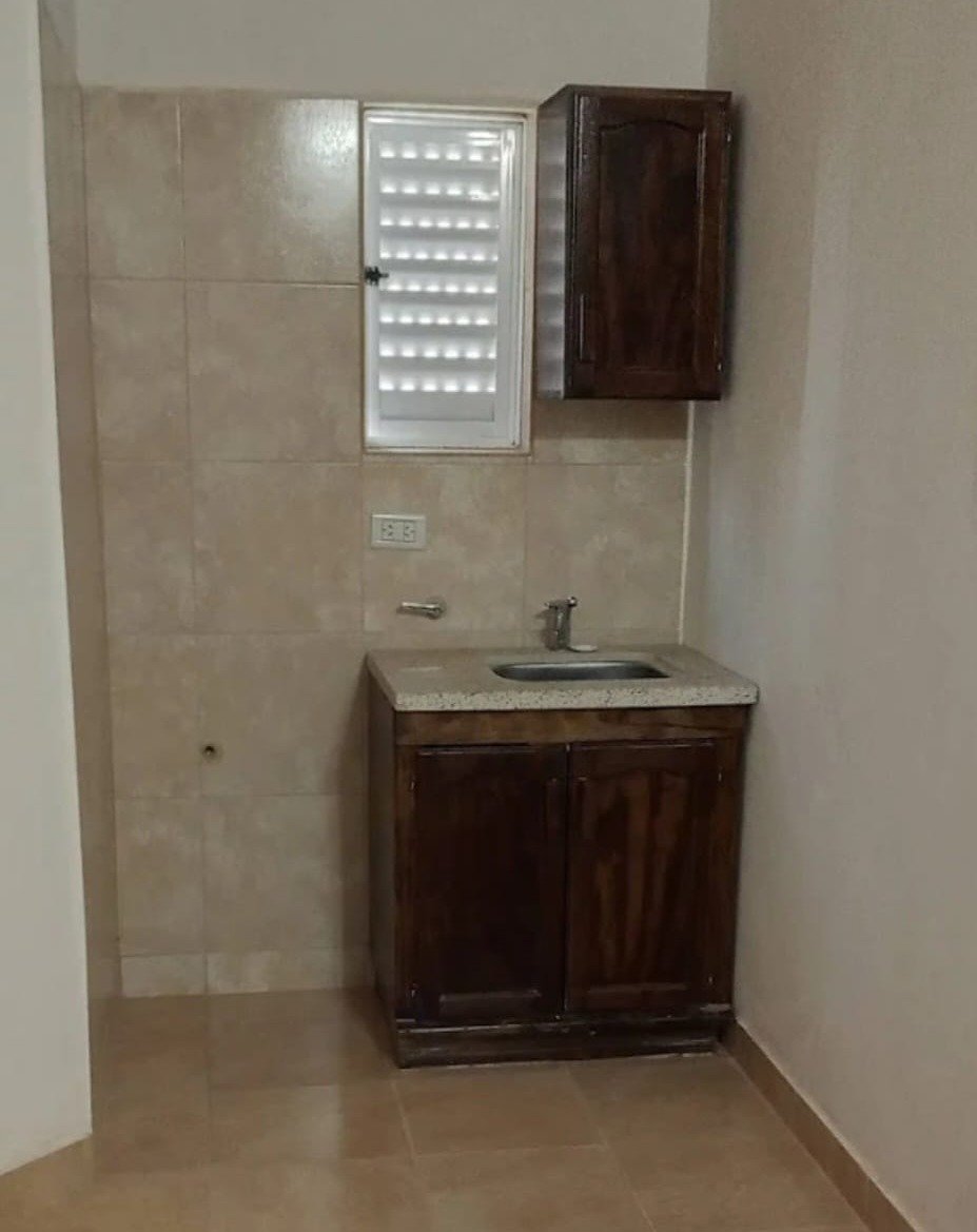 Kitchenette with sink and cupboard