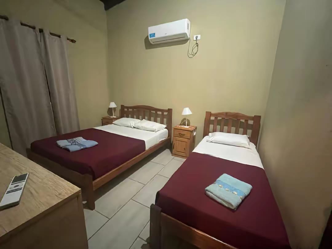 Room with two beds and air conditioning