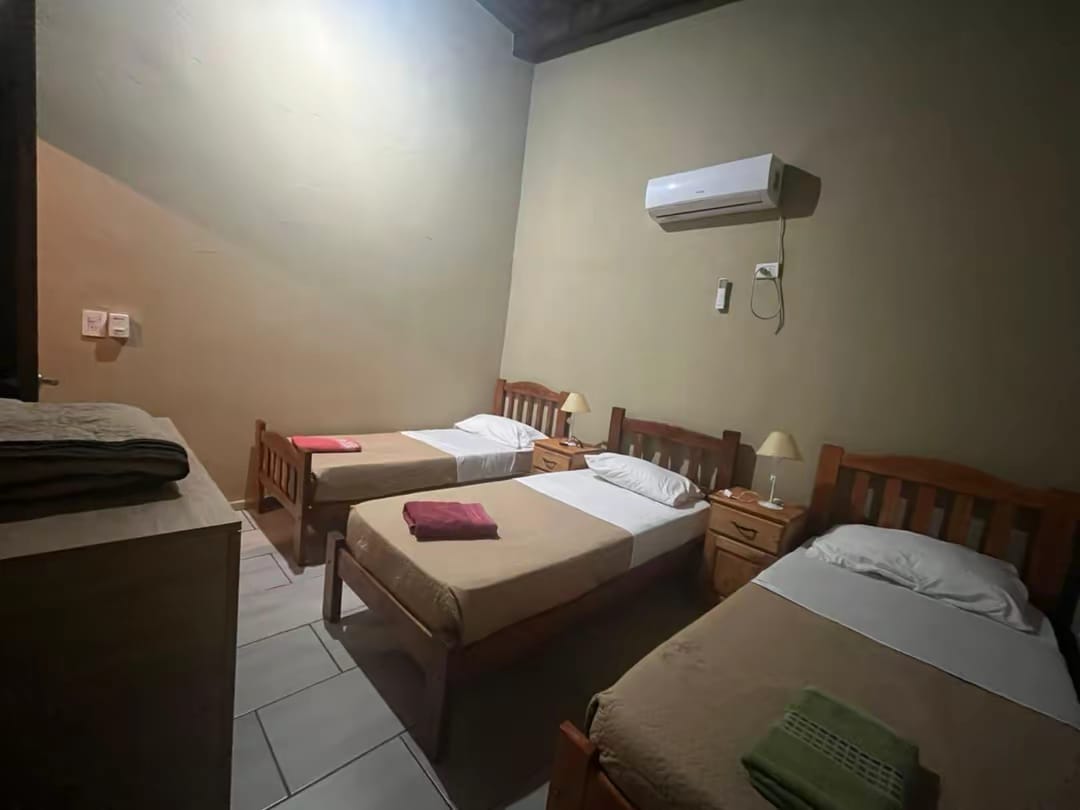 A room with three beds