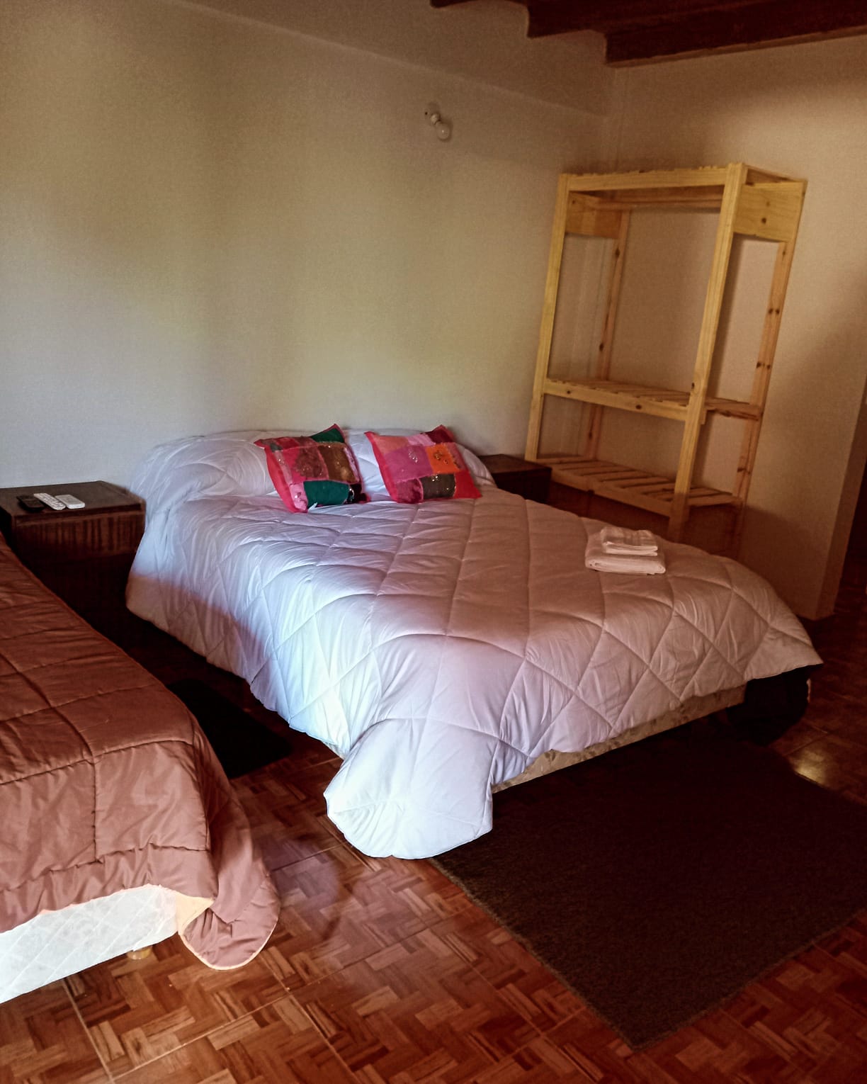 The bedroom, with a double bed and air conditioning