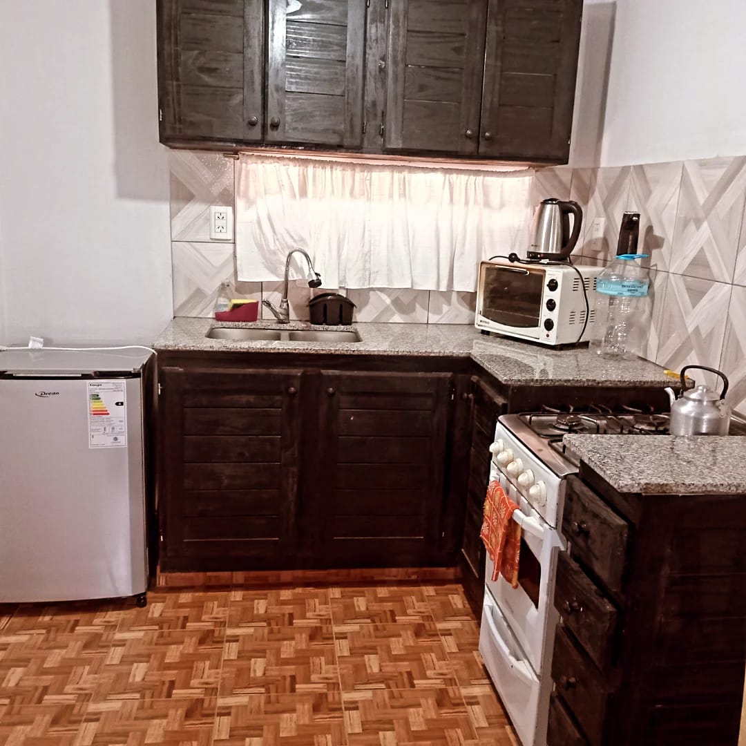 The kitchen, with fridge, oven and stove