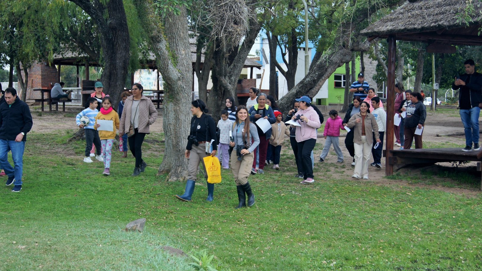 A group in the square, by the trees