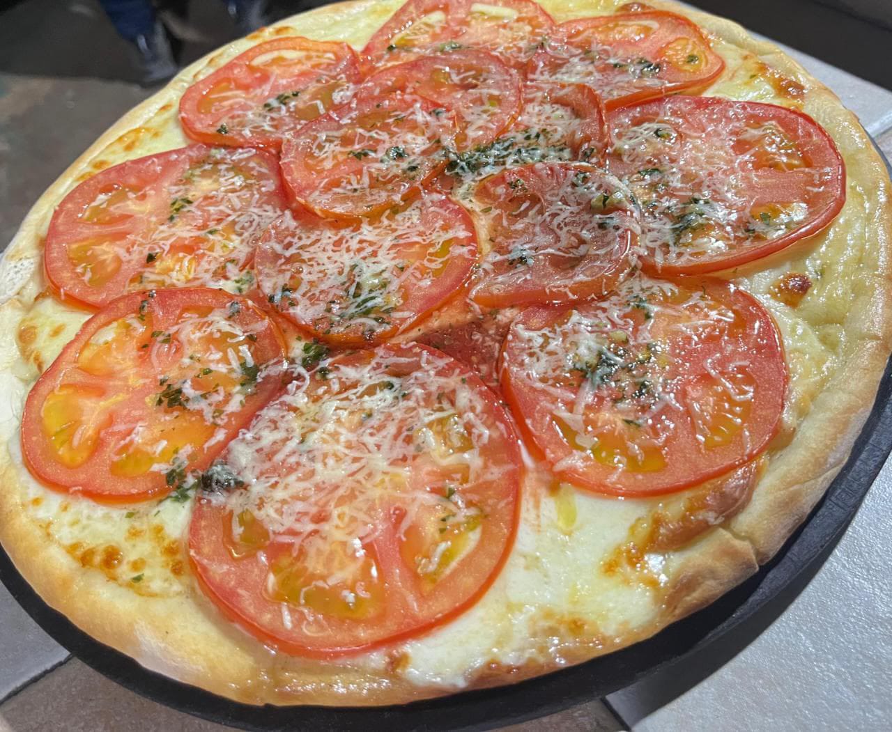 Napolitana pizza with tomato and garlic, stone-baked