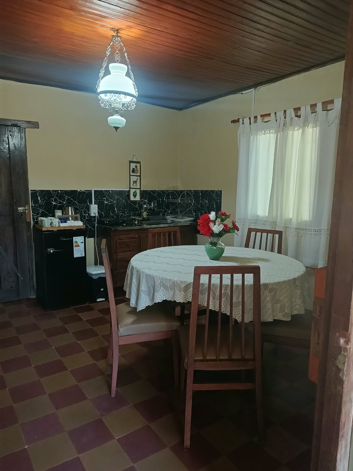 The dining room, with the kitchen at the back