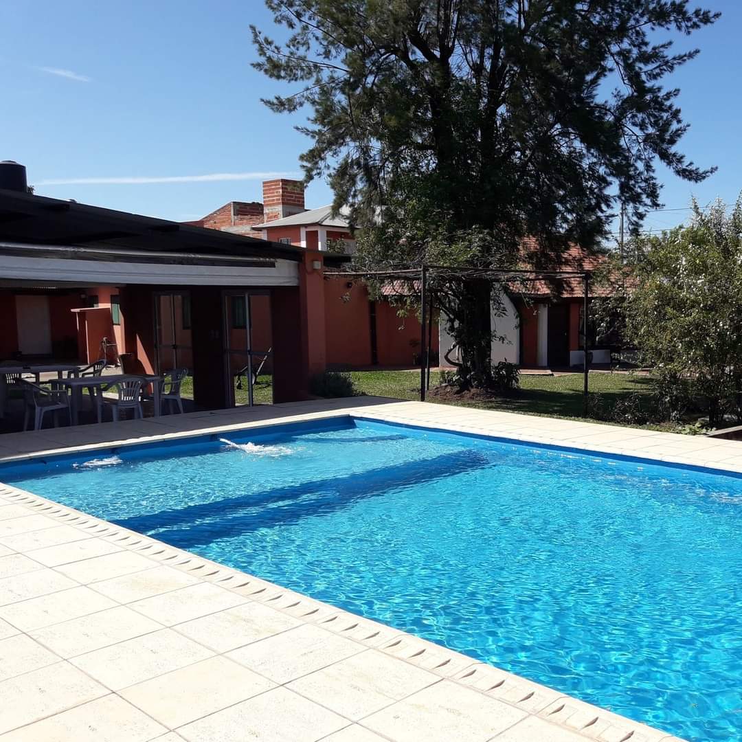 The swimming pool, with the quincho in the background